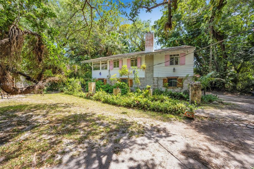 Tucked inside the exclusive, guard-gated Banyan Lakes community, this charming 3BR/2BA 1937 home sits on a lush 21,344 sq. ft. lot with mature trees and timeless Coral Gables character. Protected historic designation preserves its classic architecture—any exterior changes require city approval. Can be sold with the adjacent 2BR/2BA home at 10015 Snapper Creek Rd for a rare compound opportunity. Prime location near top schools, shops, and city amenities.
