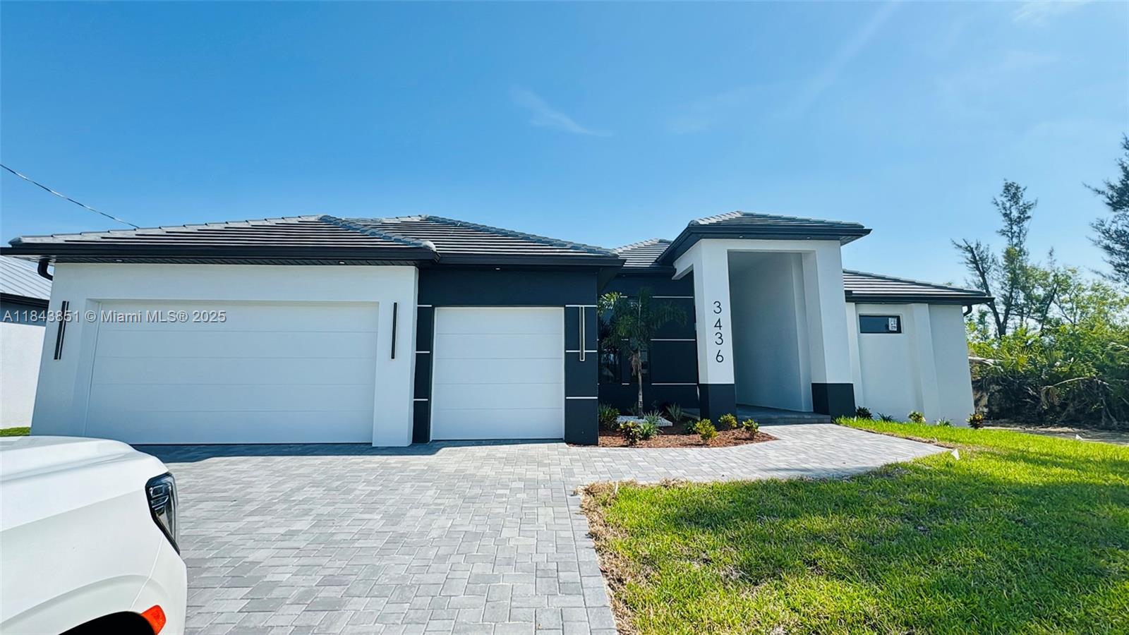 MORE PICTURE COMING SOON !Welcome to your dream home in the highly desirable SW Cape Coral area, just moments from Burnt Store Road! This stunning 4-bedroom, 3-bathroom residence offers the perfect blend of luxury and functionality. Located on a wide canal, enjoy serene waterfront living with direct access possibilities.Step outside to your private oasis featuring a screened-in pool, modern-style outdoor kitchen, and a refreshing outdoor shower. Inside, you'll find soaring 12-ft ceilings, a spacious open floor plan, and elegant tile throughout. The gourmet kitchen and spa-like bathrooms are crafted with top-tier finishes for ultimate comfort and style.The property also boasts a tile roof, beautifully paved driveway, and an oversized 3-car garage.