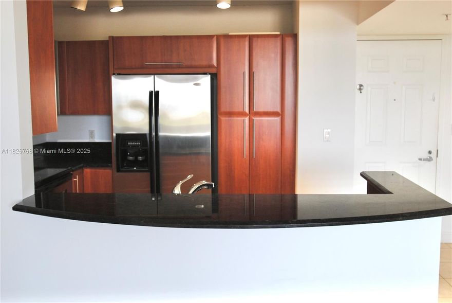 Gables Marquis is the gem high rise condominium building  in the neighborhood and this 2/2 with a private balcony, modern kitchen with granite counters and stainless appliances, a split bedroom plan with two full baths is a luxurious place to call home.  Located just steps from grocery, retail shopping and Sergio's Restaurant, it is also close to Miracle Mile, the Airport and Downtown Miami.  The building has on-site management, an elegant and welcoming Lobby, Parking and private garage storage and friends staff.  The unit is Vacant and East to show and ready to move into.