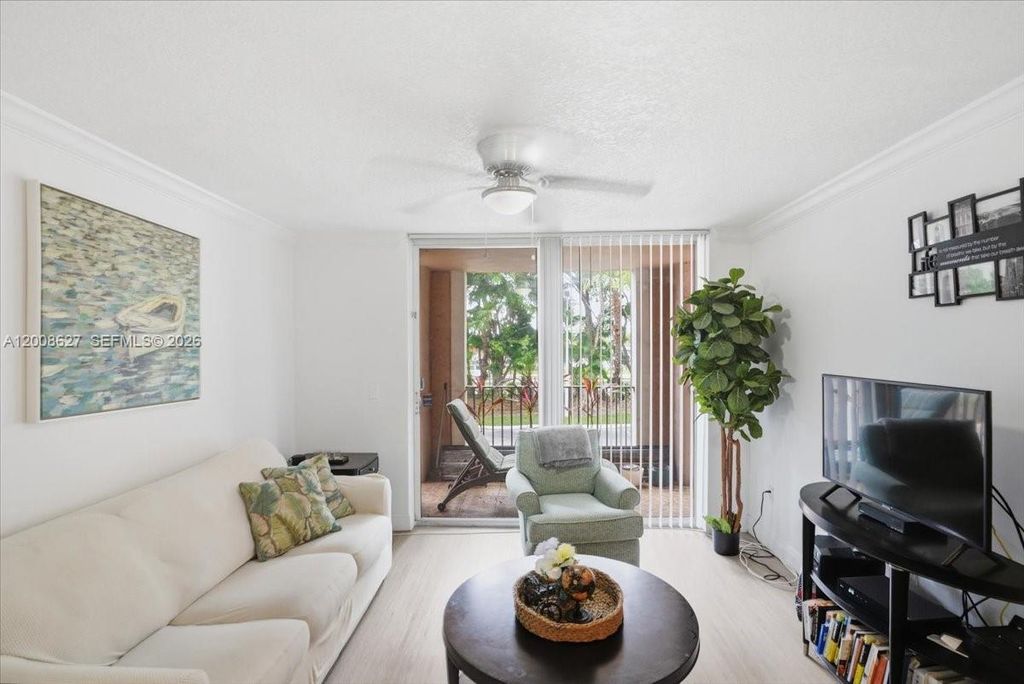 Photo of 12166 Saint Andrews Pl #203, Miramar, FL 33025 (MLS # A12008627)
