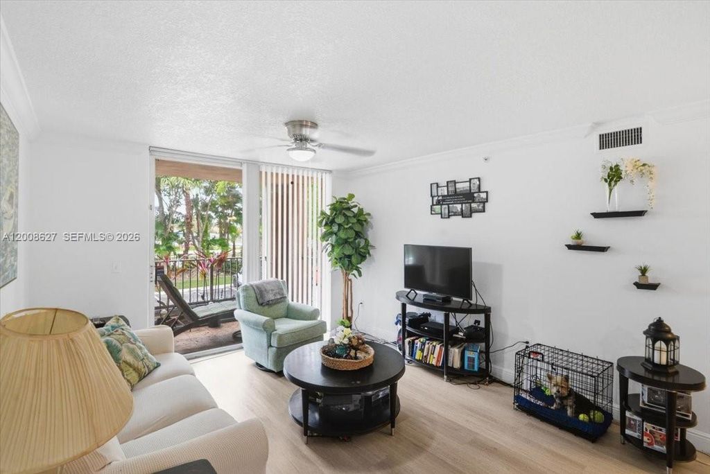 Photo of 12166 Saint Andrews Pl #203, Miramar, FL 33025 (MLS # A12008627)