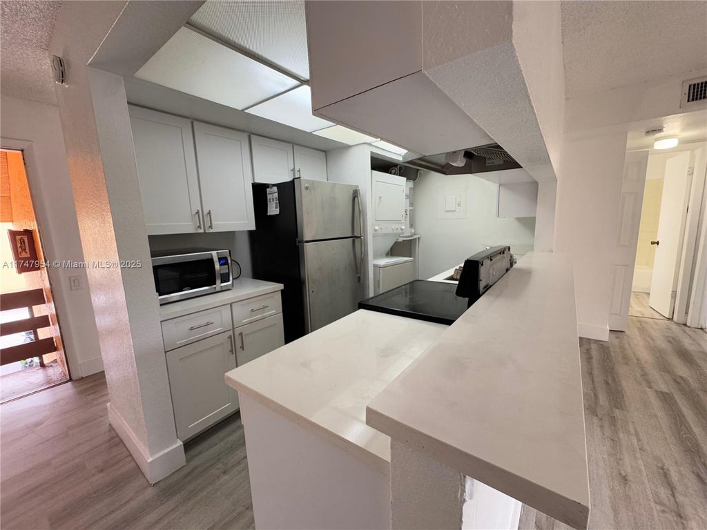 Photo of 4535 Treehouse Ln #F, Tamarac, FL 33319 (MLS # A11747954)