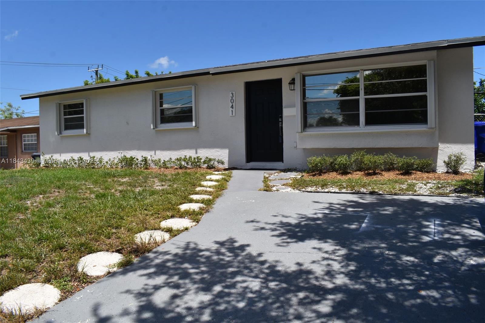 NEW 2025 roof! Full set of hurricane accordion shutters, laminate flooring - updated kitchen with granite countertops and stainless steel appliances. The bathrooms are also updated and modern! This is a true 3-bedroom 2-bathroom home with no conversions, situated high on the lot. It even has a laundry room inside under air! Screened-in patio, fenced yard with a big walk-in shed. The property has ample parking. Fresh paint inside and out - move right in, no repairs needed, AC 2021 and the water heater 2022. Easy to show, easy to sell, easy to insure!