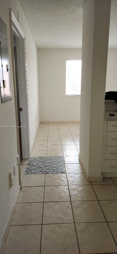SECOND FLOOR UNIT, TILED FLOORS. GREAT LOCATION CLOSE TO 836 AND AIRPORT.