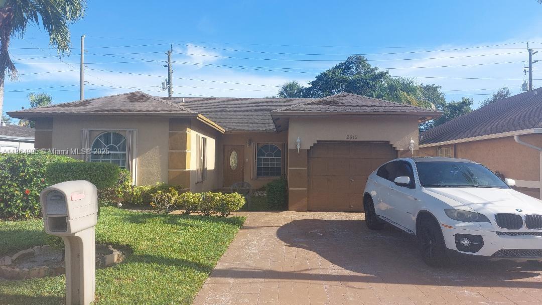 Don’t miss your chance to own this newer 3-bedroom, 2-bathroom single-family home, ideally located in the heart of Fort Lauderdale. This well-maintained property features a spacious front porch, a separate den perfect for a home office or flex space, and a desirable split-bedroom floor plan offering added privacy. Additional highlights include accordion hurricane shutters throughout, a convenient one-car garage, and modern finishes. Centrally located near shopping, dining, major highways, and just minutes from the beach — this home is perfect for comfortable living and easy commuting.