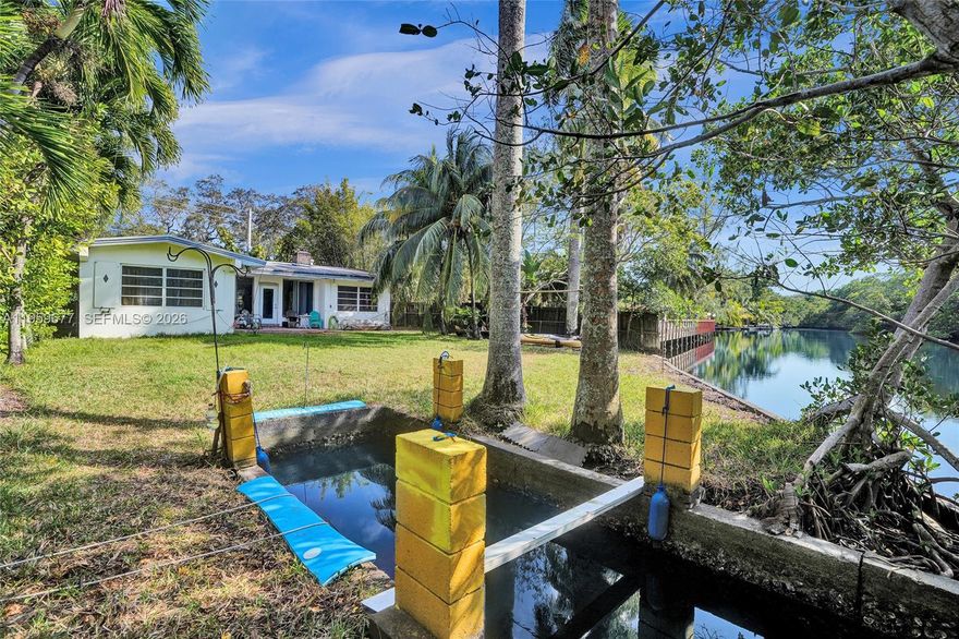 An original and charming 3BD/2BA RIVERFRONT residence offering approx. 2000 sq.ft of living space on an oversized -11,000 sq.ft lot along the pristine Oleta River- Miami-Dade County's only remaining natural, non-dredged river. Surrounded by protected mangrove shorelines and abundant wildlife, this rare setting delivers serene water views, gentle river flow, and a true connection to nature. Enjoy limited bay,intracoastal, and ocean access, plus a private basin ideal for small motorcraft, kayaks, canoes and paddleboards- creating a peaceful backyard waterfront retreat. Ideally located in the revitalizing Riverdale/ Ojus community, just minutes to Aventura, Sunny Isles Beach, shopping, schools of worship, offering a perfect blend of natural tranquility and urban convenience.