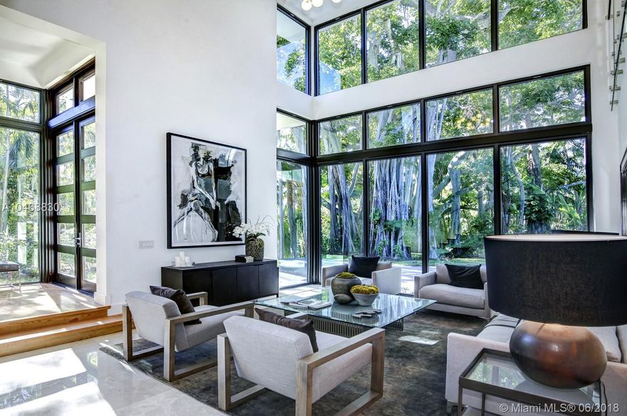 This brand new contemporary masterpiece is located on a tranquil street only minutes from the center of beautiful South Grove and the shops of Merrick Park. It offers a superb floor plan comprising six bedrooms, seven full bathrooms, and a powder room. The property conveys the sensibility of being outdoors, due to its floor to ceiling windows overlooking the lush landscape of Coconut Grove. The interior space was meticulously designed and luxuriously appointed with marble and solid wood floors. Nowhere else can one experience a lifestyle such as this.