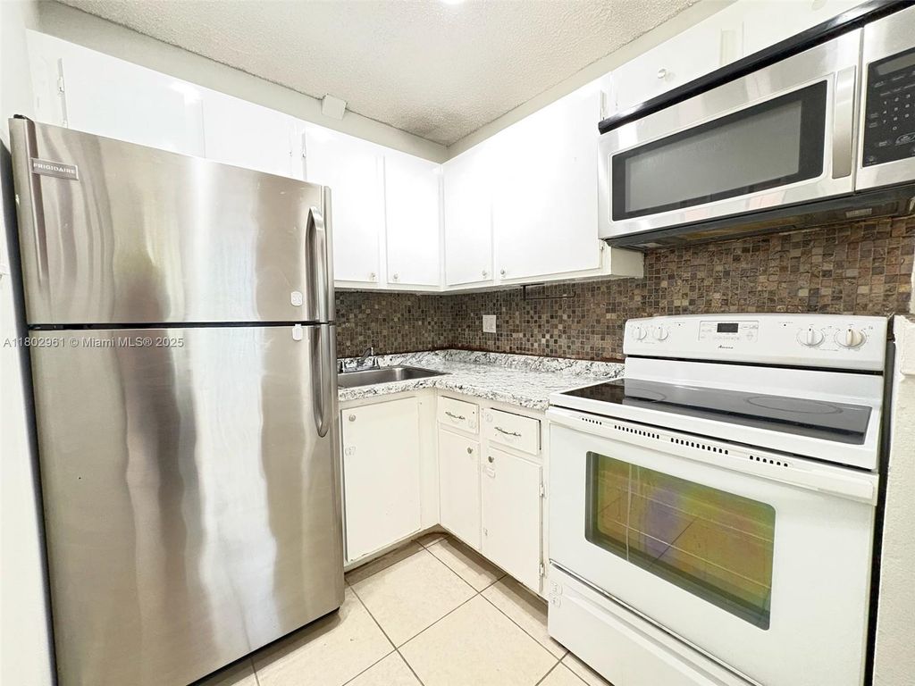 Photo of 95 NE 41st St #I144, Oakland Park, FL 33334 (MLS # A11802961)