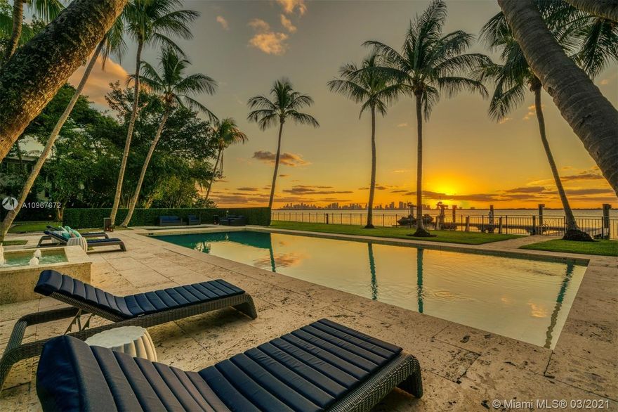 Stunning and historic waterfront Mediterranean revival estate. The 10,769 SF estate is situated on beautiful Biscayne Bay with mesmerizing bay and skyline views. Positioned on a sprawling 52,881 SF lot offering 184’ of WF. A stately gated entry opens to a royal palm forest, gorgeous curved coconut palms & 6,000-gallon koi pond. Evoking the architecture of Spain & Italy w/exquisite arched arcades & covered terraces. Interior beckons w/ a grand 2-story rotunda cupola foyer & 150-year-old reclaimed hardwood, customized chef’s kitchen, enchanting courtyard, principal suite w/ custom-designed walk-in closets & private terrace, wine cellar & elevator. The estate’s exterior boasts a large pool & spa surrounded by a Dominican coral stone deck, a summer kitchen & cabana, & a large private dock.