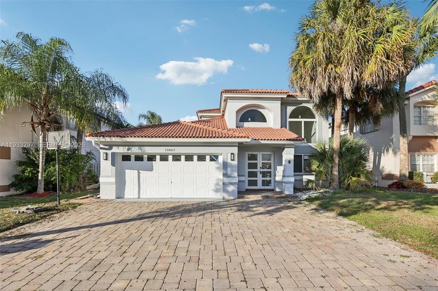 Welcome to this spacious 4-bedroom, 3.5-bathroom home ideally located in the highly desirable Plantation Acres community of Plantation. Known for its large lots, privacy, and equestrian-friendly setting, Plantation Acres offers a peaceful lifestyle with convenient access to major highways, shopping, dining, and top-rated schools.

This home features impact windows and impact doors for added security and peace of mind, along with smart-home technology that enhances comfort and efficiency. Designed for both everyday living and entertaining, the property boasts quartz countertops, a built-in sound system, and an open, functional layout.

Step outside to your private backyard oasis complete with a pool and outdoor kitchen, making it perfect for hosting gatherings year-round. A rare opportunity to enjoy space, modern upgrades, and an unbeatable location all in one exceptional home.