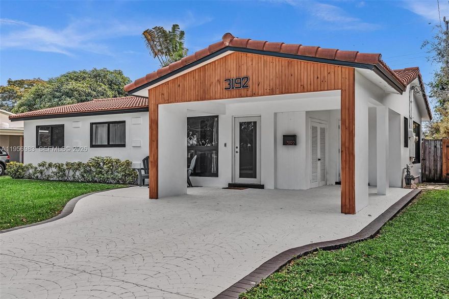 Beautiful pool home in Hollywood on a quiet street with NO HOA, newer roof and impact windows and doors.  This pristine home is renovated with a spacious layout, fully updated kitchen with granite countertops and new bathrooms.  This house is a perfect blend of comfort and charm.  Enjoy this tropical retreat with an oversized pool, lush landscaping, and an amazing tiki hut, perfect for entertaining. The home is filled with natural light, offering multiple entertaining areas, and a huge laundry room with plenty of storage. Close to the beach, shopping and highways.