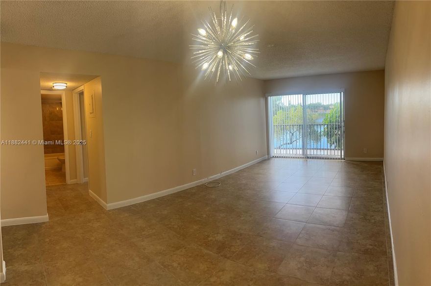 Welcome to 8600 North Sherman Circle, Unit 203. This spacious 2-bedroom condo offers an open layout filled with natural light, a private balcony with water views, and generously sized bedrooms for ultimate comfort.

Enjoy the security of a manned gated community with a pool and the added convenience of water included in your monthly rent. Perfectly located near major highways, parks, shopping, and dining, this home delivers the ideal mix of peace, style, and everyday convenience.