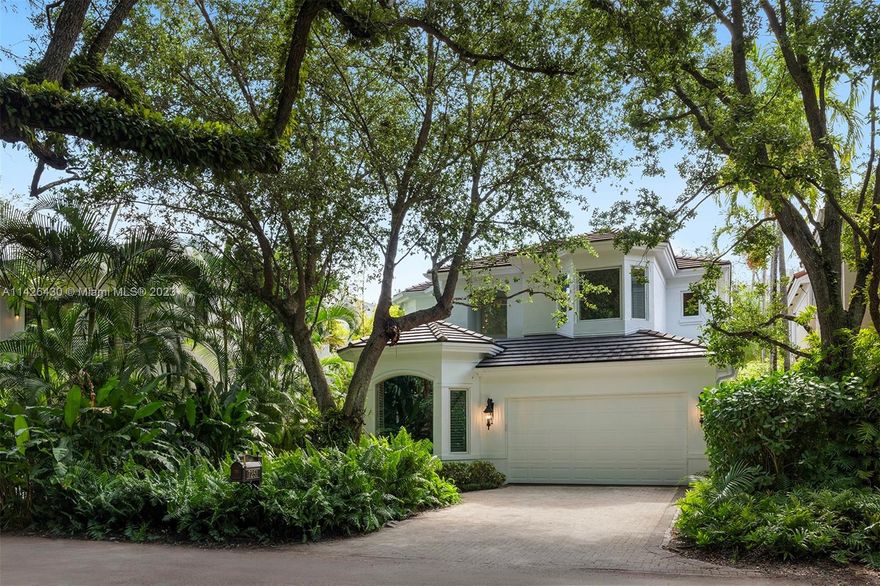 Elegant 2 story 3702 sq ft villa with 3 bedrooms, 4.5 bathrooms, and a den/office in a desirable Ponce Davis neighborhood, surrounded by dense tropical foliage and a soaring canopy of ancient oaks. Features include a grand entry, volume ceilings, an abundance of natural light, open family room and exquisite architectural details. The kitchen has Subzero and Thermador appliances and an oversized island that seats 8. The primary suite has a spacious private terrace, 2 walk-in closets, built-ins, and dual bathrooms. Also includes an elevator, a 2-car garage, built-in BBQ, travertine and wood floors, and impact doors and windows. Located near excellent schools, Baptist Hospital, University of Miami, and convenient to Miami International Airport, Coral Gables, Coconut Grove, and South Miami.