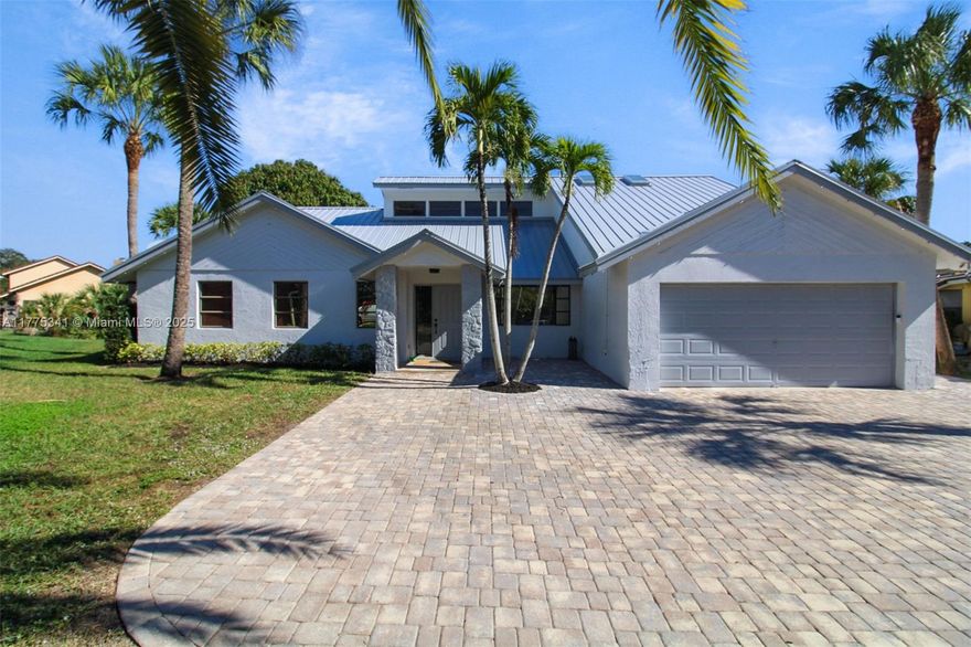 EXECUTIVE POOL HOME NESTLED ON A QUIET CUL-DE-SAC IN DESIRABLE RAMBLEWOOD, CORAL SPRINGS. RECENTLY RENOVATED WITH HIGH-END UPGRADES, THIS HOME BOASTS A NEWER GOURMET KITCHEN WITH COFFEE AND WINE BAR, LARGE ISLAND, 42INCH CABINETS, NEWER APPLIANCES, STORM PROTECTION, COZY FIREPLACE, LOFT, NEW METAL ROOF WITH SKYLIGHTS, 2 NEWER A/C UNITS, SMART LIGHTING, SMART THERMOSTAT, SMART GRASS SPRINKLER SYSTEM, NEW INT/EXT PAINT, TREMRON PAVER-TILE DRIVEWAY, CABANA BATH, AND A BREATHTAKING POOL AREA OVERLOOKING A SERENE CANAL. EASY ACCESS TO TOP-RATED SCHOOLS, SHOPPING, AND MAJOR FREEWAYS. SEE ATTACHMENTS FOR FULL LIST OF UPGRADES. WELL-MAINTAINED AND MOVE-IN READY - THIS IS A PERFECT BLEND OF LUXURY AND LOCATION! CALL AGENT TODAY FOR MORE DETAILS AND ARRANGE FOR A PRIVATE VIEWING.