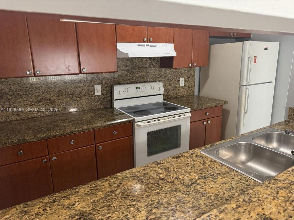 Photo of 11580 NW 43rd Ct #11580, Coral Springs, FL 33065 (MLS # A11928569)