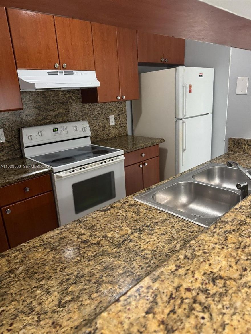 Welcome to this bright and comfortable 3-bed, 2-bath condo located in the desirable Coral West community. The home features a spacious layout with a well-designed living and dining area, perfect for everyday living.The kitchen comes equipped with white appliances, including a refrigerator, electric range, dishwasher, and ample cabinet space. For added convenience, the unit includes an in-unit washer and dryer. Enjoy year-round comfort with central A/C. Coral West is a quiet, open community that offers a welcoming environment and close proximity to shopping, dining, schools, and major roads. This is a wonderful place to call home—move-in ready and easy to show.