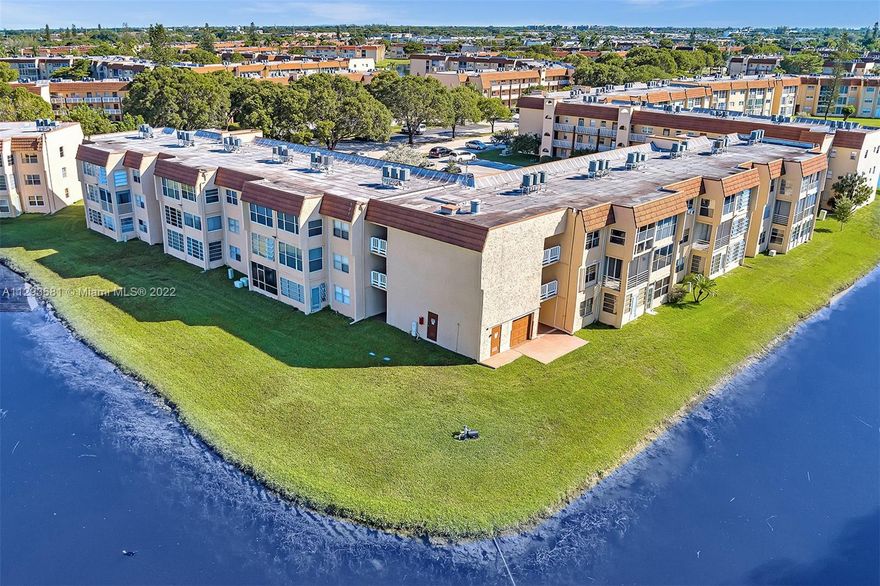 Meticulously maintained and tastefully updated 1 bed/1.5 bath corner unit condo offers peaceful and private water views. Interior features eat-in kitchen with wood cabinets and overlooks the spacious great room, new laminate wood flooring in all living areas, retiled bathroom with wood cabinets and master bedroom has 2 generous closets. Freshly painted! The large screened and tiled balcony is complete with accordion hurricane shutters. Steps to laundry facility & elevator. Lots of amenities including golf course, fitness center, theater, shows & movies, billiards, card rooms, dance classes, clubs to join, pools, spa, sauna, water aerobics, tennis, pickleball, & shuffleboard. Basic cable and water included. Don't miss out on this amazing opportunity!