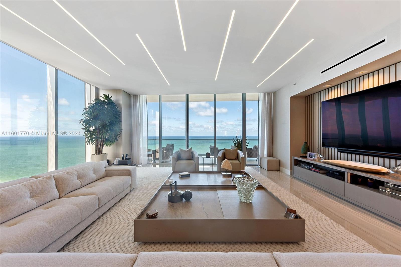 TURN-KEY FORMER DEVELOPER MODEL at the exclusive Turnberry Ocean Club. Luxury oceanfront flow-through corner residence offered complete turn-key furnished and professionally designed. Breathtaking views of the ocean and intracoastal to enjoy sunrise and sunset. Desirable middle floor, perfectly situated at the right height for privacy and views. 4 spacious bedrooms plus den/staff room, with private elevator lobby. 70,000 sq ft of amenities, including a spectacular sky club, private restaurants, luxurious spa, entertainment rooms, infinity pools and much more. Enjoy unparalleled service and a fantastic lifestyle for the entire family. Come fall in love.
