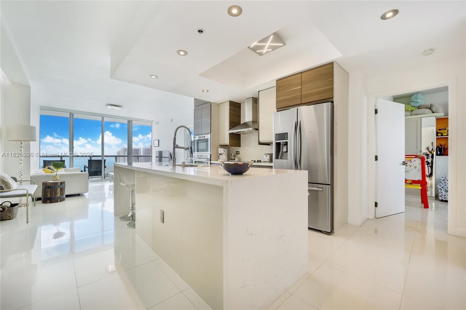 Best priced "05 Line" unit in the building. Beautifully remodeled 2 bed 2 bath + Den. Balcony offers ocean/bay and city skyline views. Immaculate and move-in ready apartment with high end finishes and designer upgrades. Marble countertops, stainless steel appliances, 5-star building amenities, gym, pool, beach volleyball, sauna and more. Walking distance to Miami's finest Museum Park, minutes away from Brickell, Miami Beach and Miami International airport. Sunrise and Sunset Views. Unit comes with storage. You don't want to miss, won't last!.