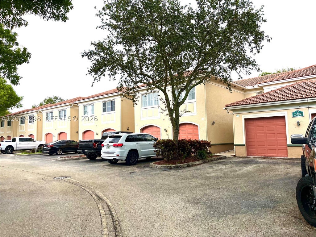 Photo of 2490 Centergate Dr #207, Miramar, FL 33025 (MLS # A12044298)