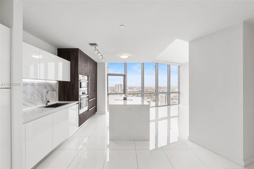 This stunning 1-bedroom, 1.5-bath luxury unit at Paramount Miami World Center offers an exceptional living experience. Featuring a private elevator, white ceramic floors throughout, and an oversized balcony with breathtaking sunset views of Miami, this home is truly one-of-a-kind. Enjoy built-out closets, blinds on all windows, and the convenience of 2 parking spots (1 valet & 1 assigned). The building boasts the world’s most amenities, including 5 pools, a spa, gym, basketball court, yoga studio, recording studio, racquetball, and more. With internet and cable included, this condo is perfect for both living and renting out. Don’t miss out on this incredible opportunity!----------UNIT RENTED TILL 10/31/2026, PAYS $4,550.00 PER MONTH -