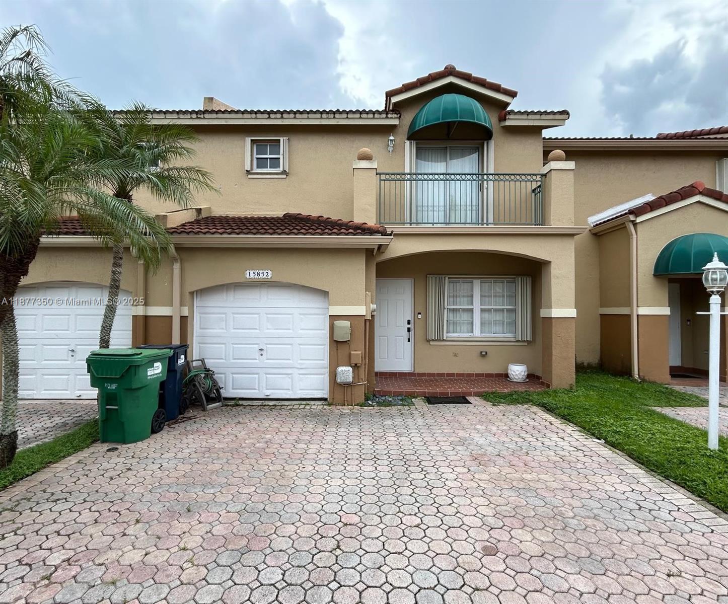 Enjoy this 3-bed, 2-bath townhouse on the second floor and a 1-bed/1-bath converted garage, ideal for those unable to climb stairs. It features a tile roof, 2024 A/C, an updated kitchen with white cabinets, granite countertops, and stainless-steel appliances, ceramic tile flooring on the first floor and laminate flooring on the second, recessed LED ceiling lights, and windows with accordion blinds. The W/D are located on the 1st floor. It has a cozy patio with access to the community garden, providing a very quiet and safe location. Enjoy a prime West Kendall location in the SAILPOINTE community, very close to Florida's Turnpike and Krome Ave, and is close to excellent schools, shopping areas, and stores such as Publix, Walmart, restaurants, parks, the public library, and Baptist Health.