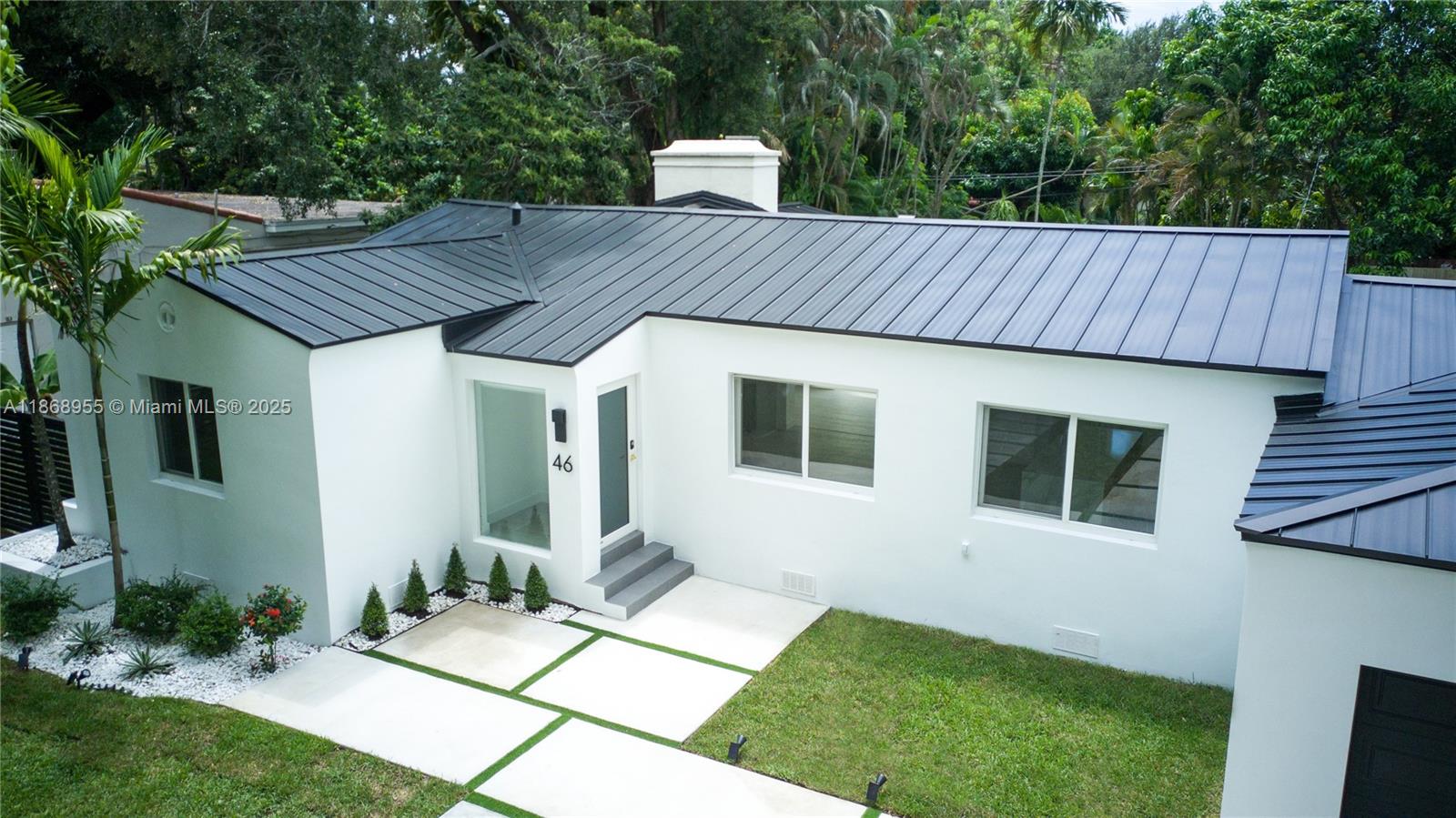 Freshly renovated Miami Shores gem on a 9,225 SF lot with a NEW 2025 metal roof, updated HVAC and a new electric water heater. Bright open layout with redesigned modern kitchen, new appliances, and new flooring throughout. Functional 3BD/2BA plan: primary suite with double-vanity bath, soaking tub + walk-in shower; second bath with walk-in shower. Private backyard oasis with pool, updated pool deck, new landscaping and irrigation system. New aluminum fencing and a newly permitted driveway with ample parking for residents and guests. Garage plus laundry with additional flex space. Move-in ready, easy to show, minutes to parks, Bay and top schools.