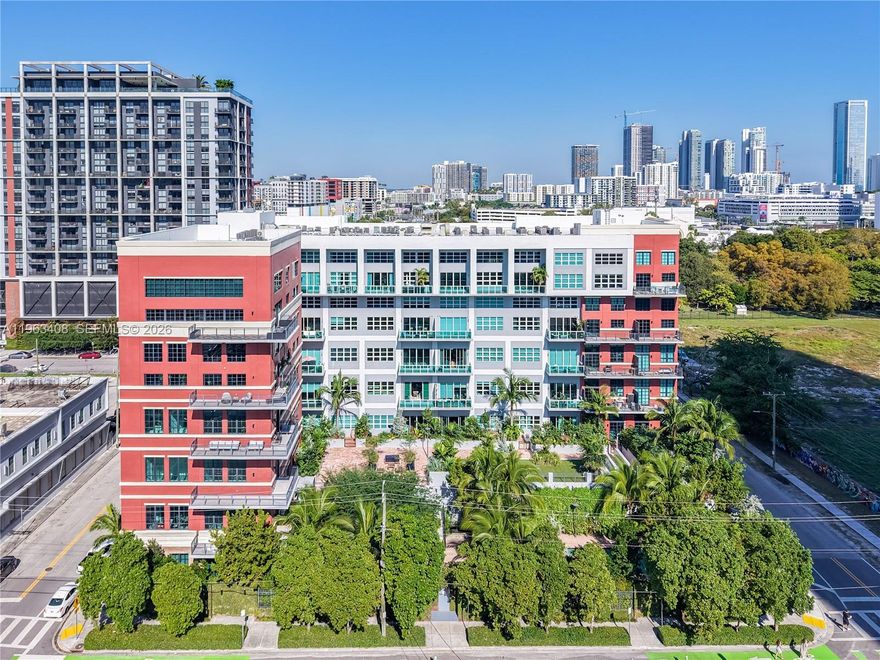 A truly rare offering, this authentic industrial loft at Parc Lofts, unit #605 delivers a level of scale, design, and character that is virtually unmatched in Miami. Defined by dramatic 20-foot ceilings and expansive, voluminous interiors, this residence offers a bold architectural presence rarely found in newer construction.

The custom-designed 2-bedroom, 2.5-bath layout blends luxury with urban edge, featuring sleek ceramic floors, bespoke built-ins, and a refined chef’s kitchen with high-end finishes and striking design elements. A dedicated formal dining area anchors the space, making it ideal for entertaining while preserving the openness of true loft living. An open den and office flex space on the second level adds a highly functional and design-forward element, perfect for a home office, creative studio, or additional lounge area.

Set within a boutique, full-service building, residents enjoy a curated lifestyle with a resort-style pool, fitness center, on-site management, and two assigned parking spaces. The intimate scale of the building enhances privacy and exclusivity.

Perfectly positioned in central Miami, moments from Wynwood, Midtown, the Design District, Miami Beach, Downtown, Brickell, and Miami International Airport, this home offers unmatched connectivity. Bold, chic, and undeniably unique—there is simply nothing else like it in Miami. Don’t miss this exceptional opportunity to own a one-of-a-kind property rarely available in today’s market!