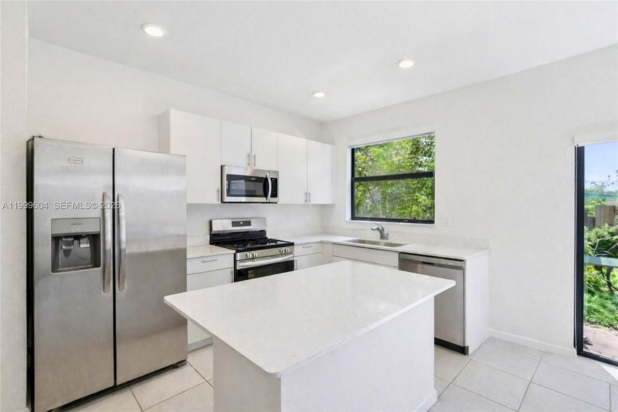 Newer construction townhome built in 2023 offering a modern layout and strong value in a newer South Miami-Dade community. This interior unit features an open-concept living space, a bright kitchen with quartz countertops and stainless steel appliances, and a private fenced backyard for everyday use.

True 3-bedroom, 3-bath floor plan including a full bedroom and full bathroom on the first floor, a highly functional layout ideal for guests, in-laws, or a flexible home office setup. Upstairs provides additional privacy with remaining bedrooms thoughtfully separated from the main living areas.

Two assigned parking spaces conveniently located directly in front of the property plus guest parking available. Community features include clubhouse, pool, and recreational amenities.

Conveniently located just off SW 137th Ave and US-1 with quick access to the Florida Turnpike, and within a reasonable drive toward Kendall, offering accessibility to major shopping, dining, and daily conveniences.

Well suited for buyers looking to personalize a newer home and make it their own without taking on a full renovation or waiting on new construction timelines.

Existing FHA loan may be assumable for qualified buyers, providing a potential opportunity to secure more favorable financing terms.

Some listing photos have been enhanced and virtually decluttered to remove furniture and personal items for presentation purposes. Property layout, structure, and finishes remain unchanged.