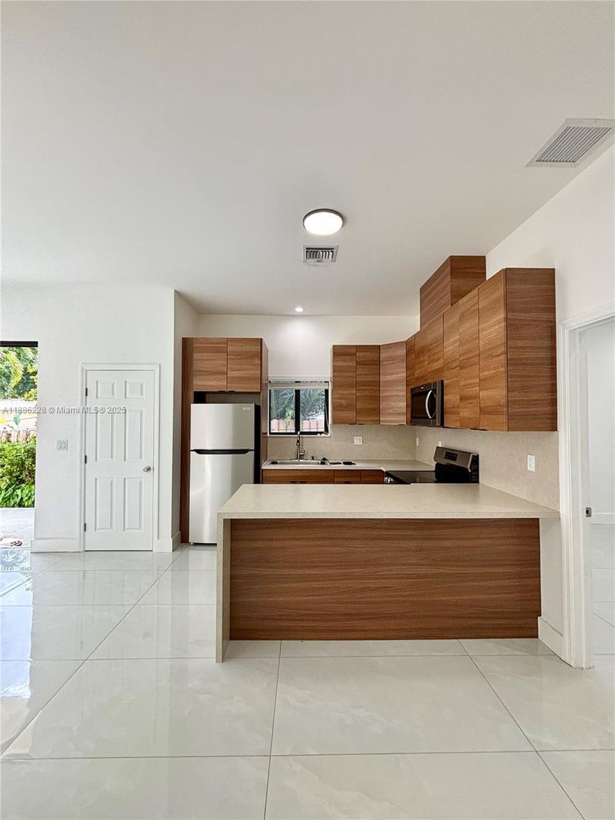 Brand-new construction offering 3 modern residences, including this spacious 2-bedroom, 2-full bathroom unit with two reserved parking spaces and all impact windows and doors. Designed with comfort and convenience in mind, the residence features an open-concept kitchen, generous living areas, large walk-in closets, storage closets, and a private backyard for outdoor enjoyment.
Fully equipped with all appliances—washer and dryer, oven/stovetop, microwave, tankless water heater, and central A/C—this unit is move-in ready. Ideally located just minutes from major highways, beautiful beaches, and vibrant Downtown Hollywood. A rare rental opportunity with no HOA restrictions in a high-demand area.