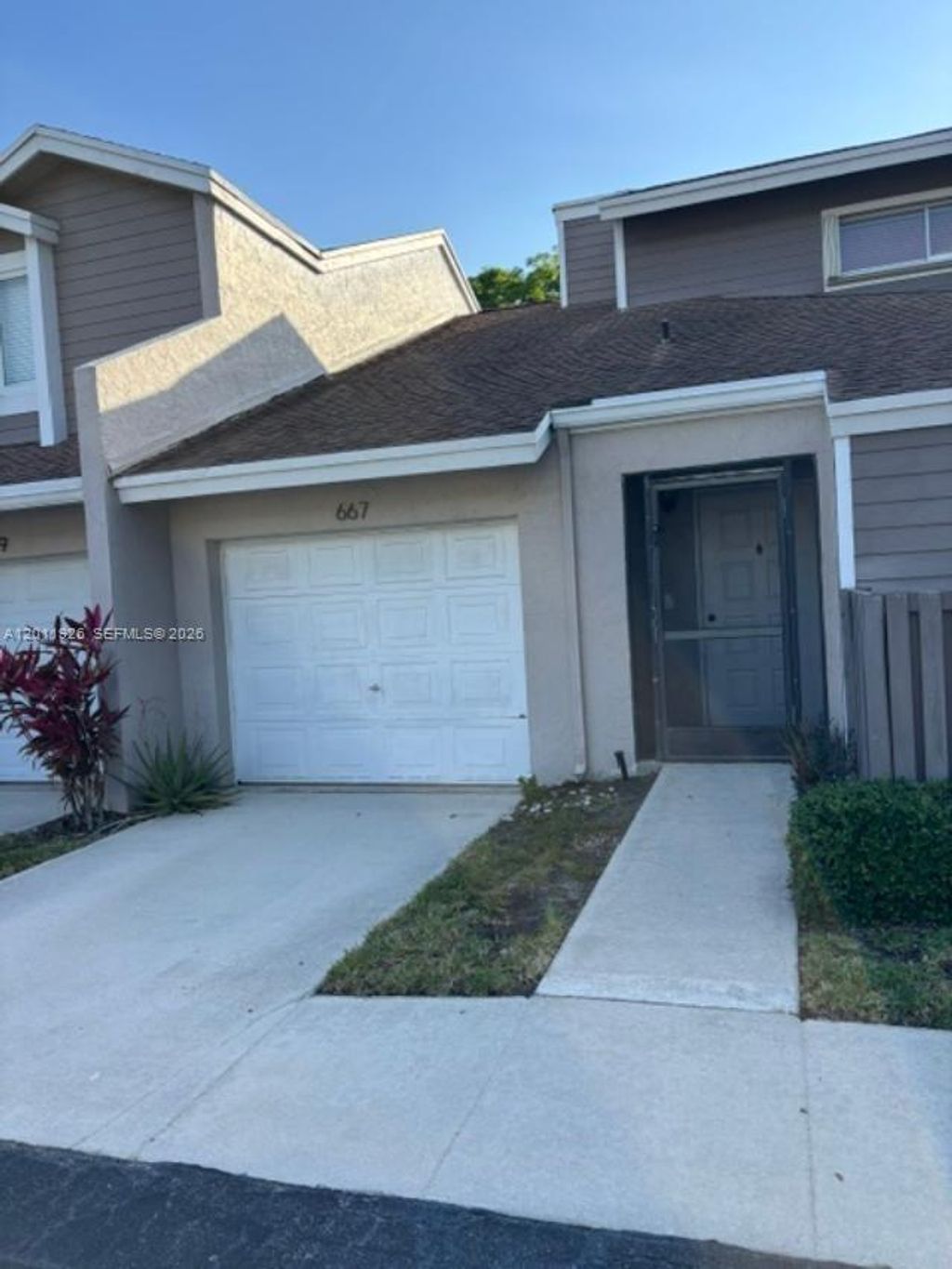 Photo of 667 Woodgate Ln #B, Sunrise, FL 33326 (MLS # A12011926)