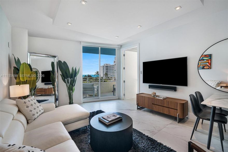 A stunning ocean view sets the tone for this beautifully remodeled one-bedroom condo in the highly coveted South of Fifth neighborhood. Just steps from the sand, this residence offers a bright, stylish interior with an inviting private balcony, brand-new hurricane-impact windows, an in-unit washer/dryer, and private indoor parking. Ocean Place is a boutique, resort-style building featuring a heated pool, Jacuzzi, updated fitness center, and modernized elevators. Recent building upgrades—including a new roof—ensure exceptional maintenance and peace of mind. With flexible short-term rental allowances of up to 12 rentals per year, this property is not only a serene beach retreat but also a strong investment opportunity in the heart of Miami Beach.