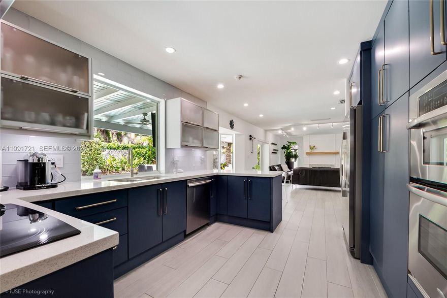 Completely remodeled Pinecrest home with summer kitchen by the pool! Turn Key! You don't need to do anything
to it. Impact windows. Open floor plan, new Air Conditioning, New Roof. Access the pool from most areas of the
house. Covered patio by the pool to entertain rain or shine! Gorgeous, updated kitchen with Whirlpool appliance
package and beautiful stone counters. Artificial Turf putting green for the avid golfer. Near excellent Pinecrest
Schools, Downtown Dadeland, The Falls Shopping Mall, The Fresh Market, Whole Foods/Target, Dadeland Mall,
Macy's, Dadeland Station, Trader Joes/Dadeland Plaza, Highway access, Pinecrest Gardens and Coral Pine Park.