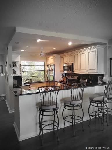 1st Floor / Corner Unit -- 3 Bedroom /2 Bathroom 
1,661 Total Sq. Footage (1411sf + 250sf glass enclosed patio under air)
Updated Open Kitchen with Granite Counter tops and ready for New Owners to add their personal touch to rest of the Condo. Unit is being sold Furnished (turnkey) or Unfurnished. Washer and Dryer in Unit.
 Live in Beautiful Pines of Boca Lago (55+ Community) in up and coming West Boca. 
Perfect for Entertaining and out of town guests, or just enjoy on your own!! Glass Enclosed Patio overlooking a beautiful Lake. Loads of room and Storage. Manned Gate and Two (2) Pools. Tennis and Golf is available on the premises through the Boca Lago Country Club (membership optio
