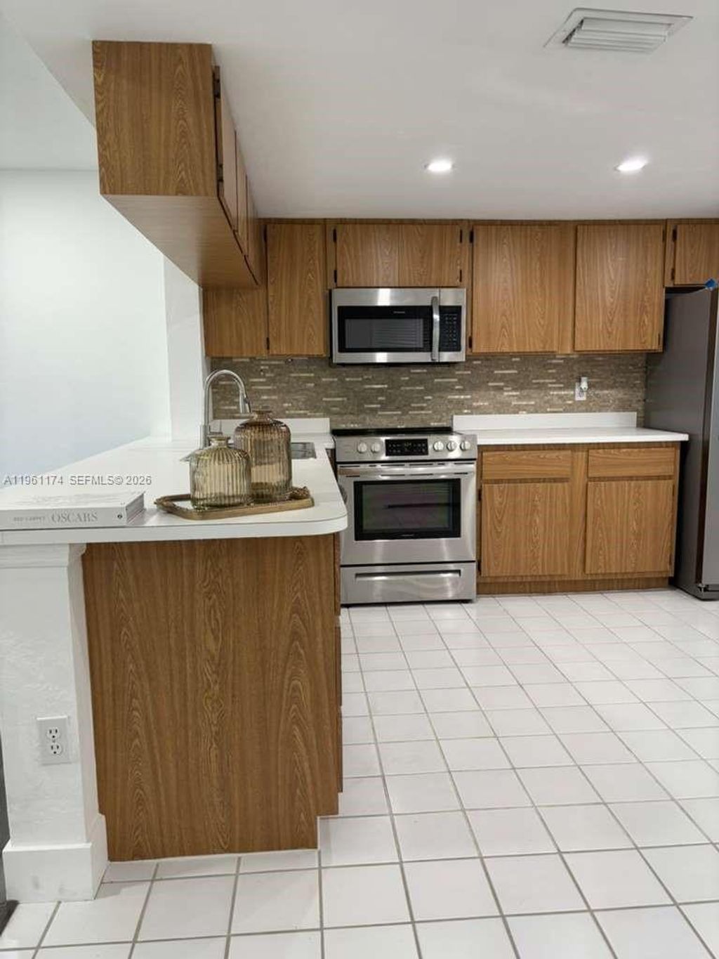 Photo of 1005 Palm Beach Trace Dr #1005, Royal Palm Beach, FL 33411 (MLS # A11961174)