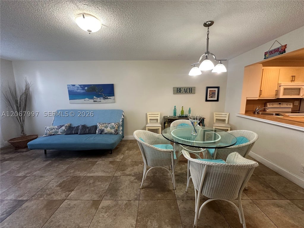 Photo of 410 SE 2nd St #115, Hallandale Beach, FL 33009 (MLS # A12067997)
