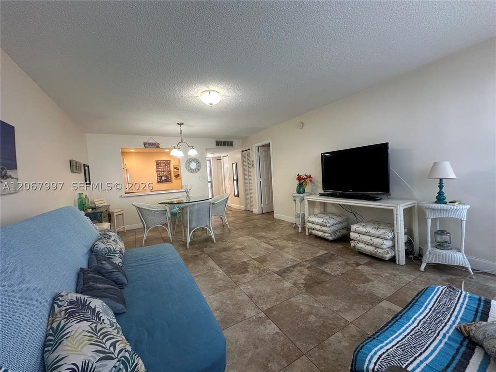 Photo of 410 SE 2nd St #115, Hallandale Beach, FL 33009 (MLS # A12067997)