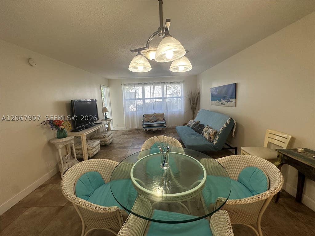 Photo of 410 SE 2nd St #115, Hallandale Beach, FL 33009 (MLS # A12067997)