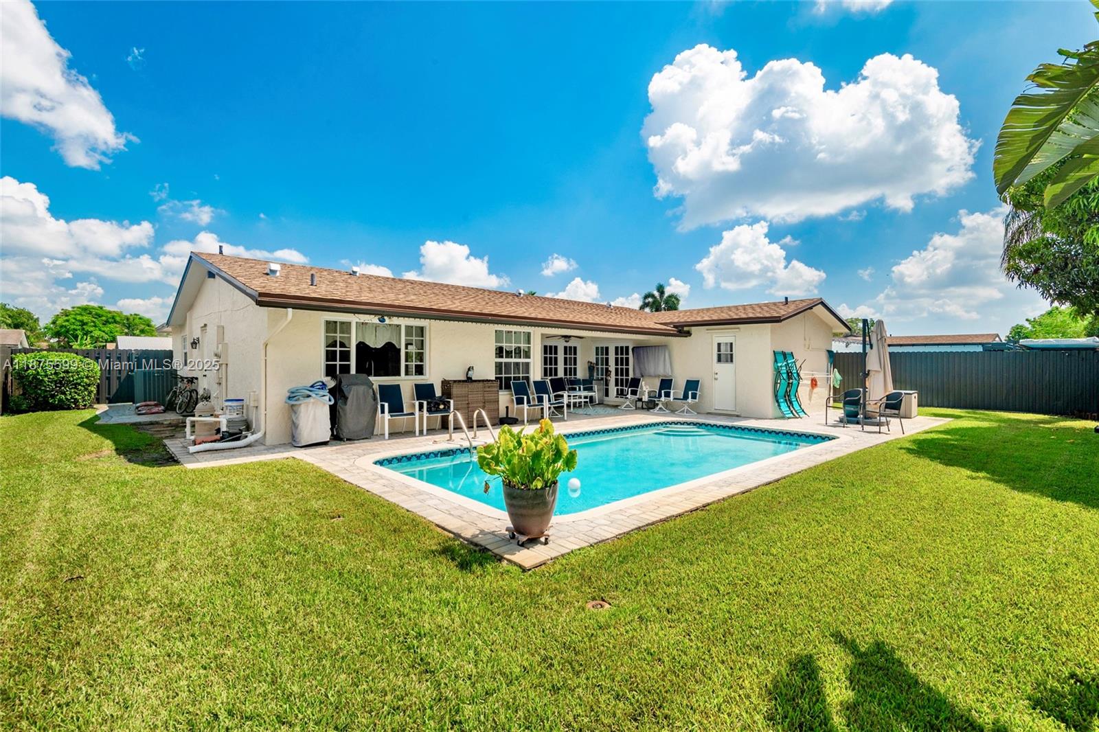 This fully remodeled 3-bedroom, 2-bathroom home is ready for a family to make it their forever home. Designed for comfort and entertaining, it’s perfect for hosting family gatherings, barbecues, and holiday celebrations.
Step outside to a covered back patio overlooking the pool area — an ideal spot to enjoy your morning coffee or watch the birds. The stamped concrete driveway provides plenty of parking, while ALL IMPACT WINDOWS AND DOORS ensure safety and efficiency.
Inside, you’ll find porcelain floors in the living areas and wood-look vinyl in the bedrooms. The home boasts a BRAND NEW ROOF (2025), beautifully remodeled kitchen and bathrooms, a tankless water heater, public sewer.