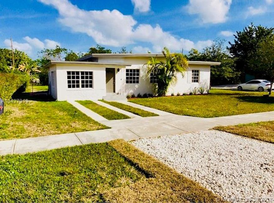 Charming corner home in South Miami. Large backyard perfect for entertaining with plenty of room for a pool.