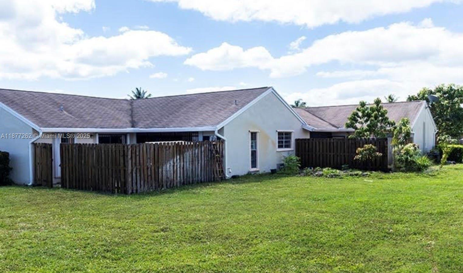 Beautiful 2 bedroom, 2 bath villa with private fenced area in gated community. Perfect for a first-time buyer or an investor’s delight. Enjoy the open design of this home with upgrades throughout including vaulted ceilings, open kitchen with newer cabinets, fenced patio. Freshly painted, washer and dryer installed in the utility room. Both bathrooms are modern. Conveniently located near highways, shopping, restaurants, Aventura Mall and the beach. Association includes exterior, roof, insurance, reserve fund and security. The complex has 2 pools, a play area, clubhouse and there are. It is a pet friendly. Equal Housing Opportunity. community. Must see.