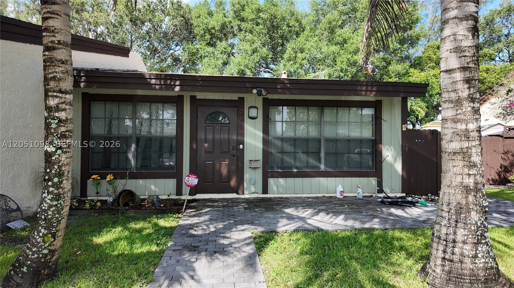 Photo of 2070 Sweet Gum Ave, Pembroke Pines, FL 33026 (MLS # A12051098)