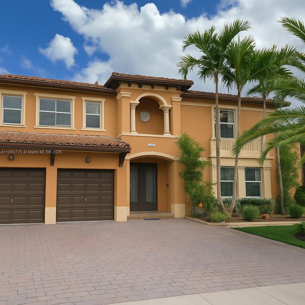 This beautiful lakefront pool home features 5 bedrooms, 5 bathrooms, and a 2-car garage in the gated community of Palermo at Venetian Isles. Upon entry, you are welcomed by marble floors, soaring ceilings, and a spacious kitchen with wood cabinetry and granite countertops. The first floor offers one bedroom and a renovated bathroom, while the second floor boasts a ceramic-floored loft and four additional bedrooms with wood floors, each with its own bathroom. The primary suite includes a large custom closet with an island, a seating area, and a private balcony overlooking the lake and pool. The home is also equipped with wood-style shutter blinds and built-in closets. Ideal for large families in a tranquil neighborhood. Come and see it for yourself. No HOA approval required.
