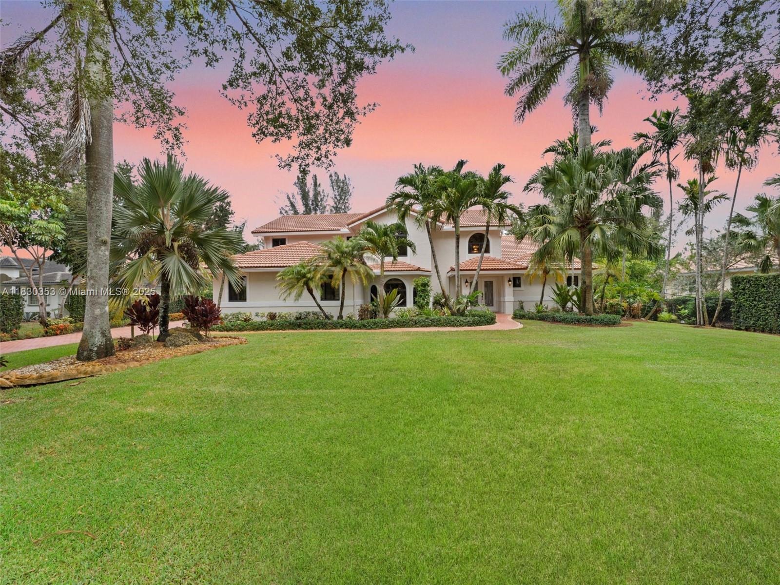 Priced Under Appraised Value & BEST PRICED 4-bed, 4-bath Home in the Heart of Plantation Acres! This 4,100+ sqft Estate sits on nearly an Acre of Lush Greenery. This Home was Thoughtfully Designed with Soaring Ceilings, a Grand Open Layout, Fully Remodeled Kitchen, Impact Windows/Doors, Full Cabana Bath, & Solar Panels for Low Energy costs. The Spacious Primary Suite features an addition that was Customized & Built out as Walk-In Closet & a Private Retreat area with Direct Access to the Pool Deck. Step outside to your own Backyard Paradise, showcasing a Heated Saltwater Pool, a Variety of Mature Fruit Trees & Space to Entertain! This is a Rare Opportunity to own in one of the Most Desirable Neighborhoods, Located near Top-Rated Schools including American Heritage- at an Unbeatable Value!