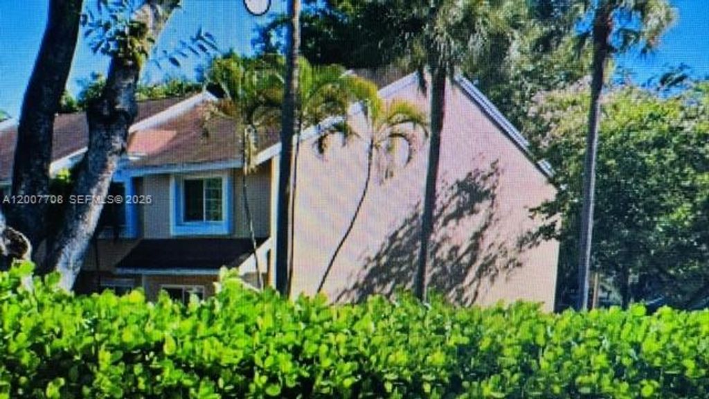 Photo of 7148 Woodmont Ave, Tamarac, FL 33321 (MLS # A12007708)