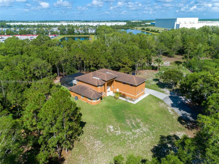 Welcome to your private Florida retreat! This custom-built estate on nearly 2 acres offers 6 bedrooms, 6 bathrooms, an office, and a game room. The chef’s kitchen features stainless steel appliances, custom cabinetry, and plenty of counter space. The primary suite is a true escape with 2 large walk-in closets and spa-like bath with dual vanities, soaking tub and separate shower. Outside, enjoy a resort-style oasis with a sparkling pool, lush landscaping and a screened patio perfect for dining, entertaining or simply relaxing in the Florida sunshine. With elegance, comfort and privacy throughout, this rare estate is ready to welcome its next lucky owner.