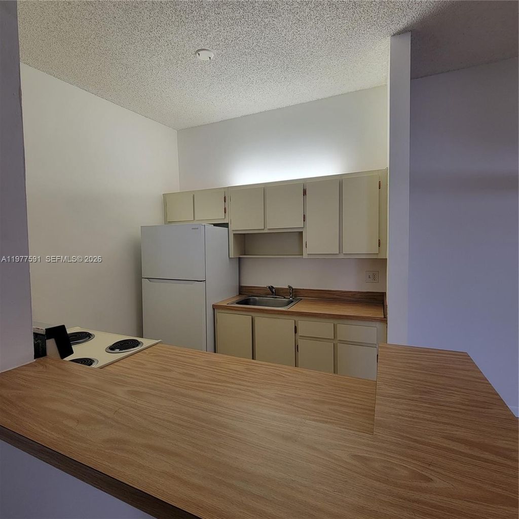 Photo of 9379 S Belfort Cir #216, Tamarac, FL 33321 (MLS # A11977591)