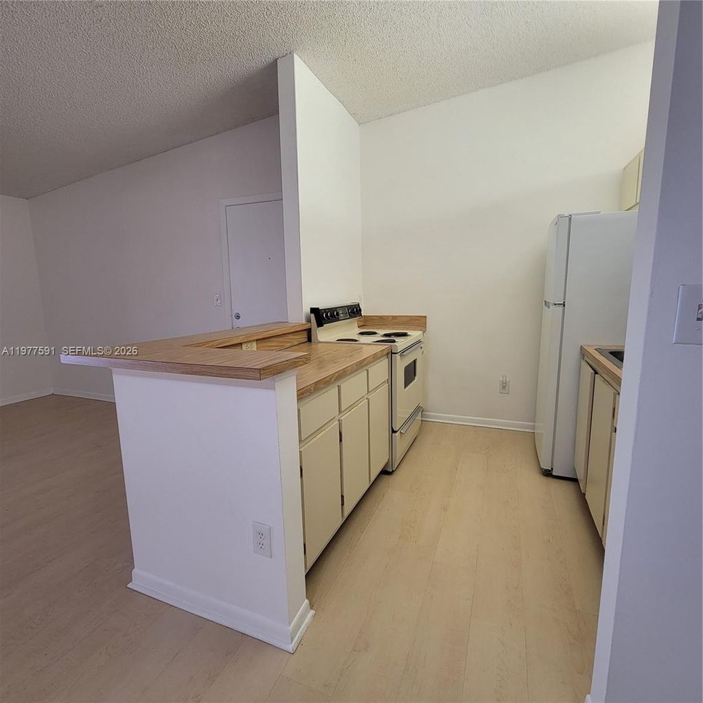 Photo of 9379 S Belfort Cir #216, Tamarac, FL 33321 (MLS # A11977591)