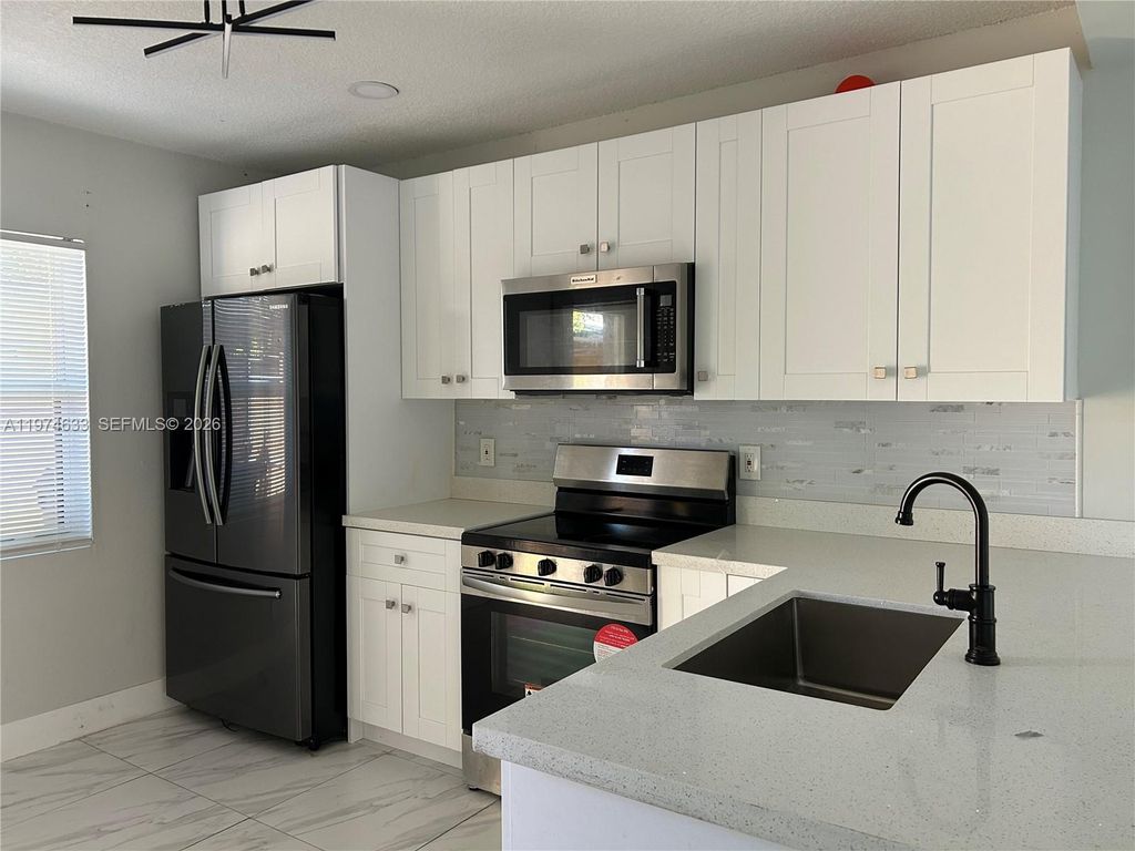 Photo of 6036 Buchanan St #2, Hollywood, FL 33024 (MLS # A11974633)