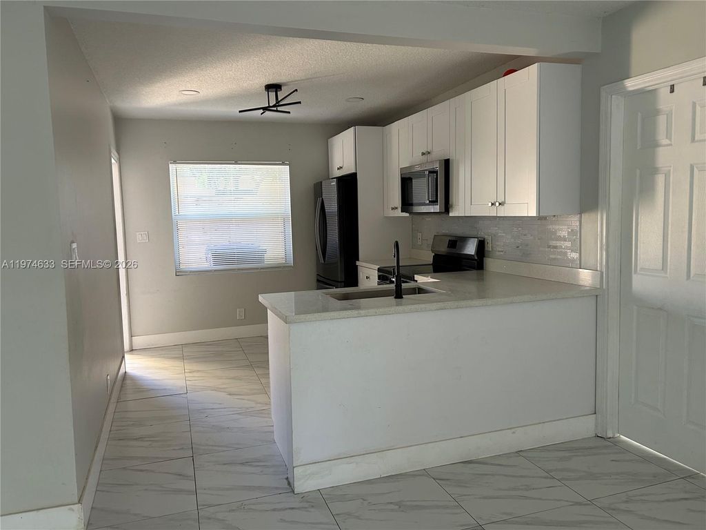 Photo of 6036 Buchanan St #2, Hollywood, FL 33024 (MLS # A11974633)